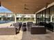 Outdoor seating area with lounge furniture and ceiling fans at 3060 Rockefeller Way # 156, Kissimmee, FL 34747