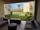 Cozy patio area with comfortable seating and views of the lush green space at 3060 Rockefeller Way # 156, Kissimmee, FL 34747