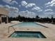 Inviting pool and hot tub with ample seating for residents at 3060 Rockefeller Way # 156, Kissimmee, FL 34747