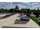 Inviting poolside cabanas and lounge chairs create a relaxing outdoor space at 3060 Rockefeller Way # 156, Kissimmee, FL 34747