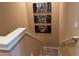 Staircase with modern artwork of NYC yellow cab photos providing a decorative, sophisticated ambiance at 3060 Rockefeller Way # 156, Kissimmee, FL 34747