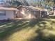 Backyard with manicured landscaping and fresh mulch, offering a serene outdoor retreat at 3 Lakeside Dr, Ocala, FL 34482