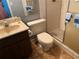 Bathroom featuring a shower, toilet, sink with vanity, and patterned tile flooring at 3 Lakeside Dr, Ocala, FL 34482