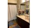 Bathroom featuring a tile floor, vanity and mirror with peach roses at 3 Lakeside Dr, Ocala, FL 34482