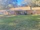 Charming single-story home with a cozy front porch and well-maintained lawn at 3 Lakeside Dr, Ocala, FL 34482