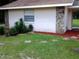 Landscaping with stone and yucca plant accents near the exterior of the home at 3 Lakeside Dr, Ocala, FL 34482