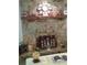 Stone fireplace with a wooden mantel and decorative accents at 3 Lakeside Dr, Ocala, FL 34482