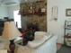 Bright living room featuring a stone fireplace and stylish decor at 3 Lakeside Dr, Ocala, FL 34482