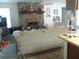 Bright living room with a stone fireplace and light, comfortable furniture at 3 Lakeside Dr, Ocala, FL 34482