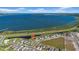 Aerial view of the property located near a scenic lake with easy access to main roads at 744 Osprey Roost Dr, Lakeland, FL 33801