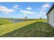 Expansive backyard overlooking a tranquil pond, perfect for relaxation and enjoying nature at 744 Osprey Roost Dr, Lakeland, FL 33801
