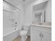 Bright bathroom with a shower-tub combo and white vanity at 744 Osprey Roost Dr, Lakeland, FL 33801