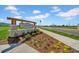 Inviting community sign for Cypress Point at Lake Parker with well-maintained landscaping at 744 Osprey Roost Dr, Lakeland, FL 33801