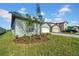 Charming single-story home with well-maintained lawn and two-car garage at 744 Osprey Roost Dr, Lakeland, FL 33801