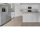 Modern kitchen featuring stainless steel appliances, an island, and white cabinetry at 744 Osprey Roost Dr, Lakeland, FL 33801