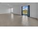 Spacious living room with a sliding glass door leading to the backyard and patio at 744 Osprey Roost Dr, Lakeland, FL 33801