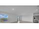 A large, well-lit living room showcasing serene water views through expansive windows at 744 Osprey Roost Dr, Lakeland, FL 33801