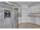 Modern kitchen featuring stainless steel refrigerator and white cabinetry at 744 Osprey Roost Dr, Lakeland, FL 33801