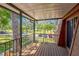 Cozy outdoor balcony with wood floors, iron railing, and neighborhood views at 159 Sweetgum Ln, Port Orange, FL 32129