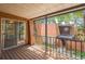 Cozy outdoor balcony with wood floors, iron railing, and residential views at 159 Sweetgum Ln, Port Orange, FL 32129