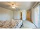 Bright bedroom with carpet, fan, and sliding glass doors to a balcony at 159 Sweetgum Ln, Port Orange, FL 32129