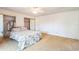 Bedroom features ceiling fan, neutral carpet, and mirrored closet doors at 159 Sweetgum Ln, Port Orange, FL 32129
