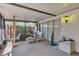 Enclosed patio featuring a concrete floor and seating area at 159 Sweetgum Ln, Port Orange, FL 32129
