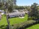 Aerial view of a home showcasing the expansive backyard and patio area at 11540 Sw 84Th Avenue Rd, Ocala, FL 34481