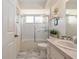 Well-lit bathroom featuring a shower-tub combo with tile surround, and a single sink vanity at 11540 Sw 84Th Avenue Rd, Ocala, FL 34481