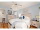 Comfortable bedroom featuring wood-look floors, neutral furnishings and soft lighting at 11540 Sw 84Th Avenue Rd, Ocala, FL 34481