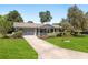 Well-maintained single-story home with beautiful landscaping and a long driveway at 11540 Sw 84Th Avenue Rd, Ocala, FL 34481