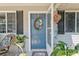 Welcoming entrance with a cheerful wreath and charming decor at 11540 Sw 84Th Avenue Rd, Ocala, FL 34481