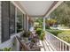 Cozy front porch with seating and views of the well-maintained neighborhood at 11540 Sw 84Th Avenue Rd, Ocala, FL 34481