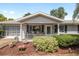 Charming home with a covered front porch, manicured landscaping, and attractive curb appeal at 11540 Sw 84Th Avenue Rd, Ocala, FL 34481