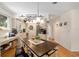 Charming kitchen featuring a wooden island with overhead pot rack and decorative details at 11540 Sw 84Th Avenue Rd, Ocala, FL 34481