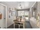 Charming sun room with nautical decor, ample lighting, and cozy dining table at 11540 Sw 84Th Avenue Rd, Ocala, FL 34481