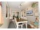 Cozy sun room with dining table, comfortable seating, and scenic views at 11540 Sw 84Th Avenue Rd, Ocala, FL 34481