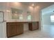 Bathroom boasts double vanity with cabinets and views to other rooms at 4910 Lyric Dr, Mascotte, FL 34753