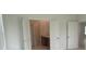 View into main bathroom from bedroom through open french doors at 4910 Lyric Dr, Mascotte, FL 34753