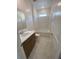 Modern bathroom with a bathtub and shower, and a vanity with a white countertop at 4910 Lyric Dr, Mascotte, FL 34753