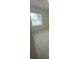 Bedroom featuring light colored walls, baseboards, and view of the outdoors through the window at 4910 Lyric Dr, Mascotte, FL 34753
