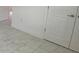 Bedroom featuring light colored walls, baseboards, door frames and decorative tile floors at 4910 Lyric Dr, Mascotte, FL 34753