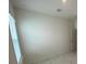 Bedroom interior featuring a window letting in natural light and a neutral color palette at 4910 Lyric Dr, Mascotte, FL 34753