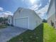 Charming single-Gathering home featuring a two-car garage and lush green lawn at 4910 Lyric Dr, Mascotte, FL 34753