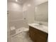 Hallway featuring light colored walls, baseboards, door frames and decorative tile floors at 4910 Lyric Dr, Mascotte, FL 34753