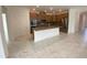 Spacious kitchen with a center island, modern appliances, and ample room for entertaining at 4910 Lyric Dr, Mascotte, FL 34753