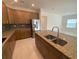 This kitchen features granite countertops, stainless steel appliances and a spacious island at 4910 Lyric Dr, Mascotte, FL 34753