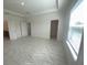 Bright main bedroom with ensuite bathroom, walk in closet, and large windows at 4910 Lyric Dr, Mascotte, FL 34753