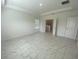 Large main bedroom with tray ceiling, ample natural light, and ensuite bathroom entrance at 4910 Lyric Dr, Mascotte, FL 34753
