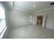 Large main bedroom with recessed ceilings, natural light, and ensuite bathroom entrance at 4910 Lyric Dr, Mascotte, FL 34753